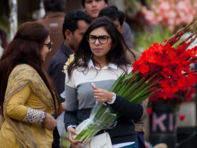 People buy flowers at a flower market, to celebrate Valentine's Day, in Islamabad, Pakistan, Tuesday, Feb. 14, 2017. A Pakistani judge has banned Valentine's Day celebrations in the country's capital, saying they are against Islamic teachings. A court official says the judge ruled on a petition seeking to ban public celebrations. Islamist and rightwing parties in Pakistan view Valentine's Day as a vulgar Western import. (AP Photo/B.K. Bangash)