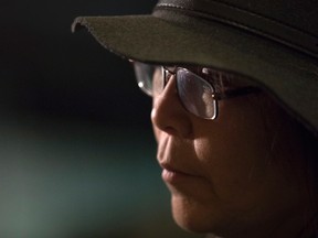 Chief Marcia Brown Martel sits for a television interview after a news conference in Toronto on Tuesday, Feb. 14, 2017 after an Ontario judge ruled Canada failed to take reasonable steps to prevent thousands of on-reserve children who were placed with non-native families from losing their indigenous heritage during the '60s Scoop. (THE CANADIAN PRESS/PHOTO)