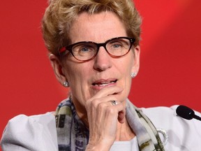 Liberal Premier Kathleen Wynne apparently has money to burn — our money — when it comes to compensating teachers. (THE CANADIAN PRESS/PHOTO)
