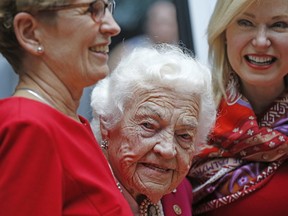 Ontario Premier Kathleen Wynne and Mississauga Mayor Bonnie Crombie flank former mayor Hazel MaCallion at the Mississauga Civic Centre. The premier presented her with a birthday present, the framed bill that declared Feb. 14 Hazel McCallion Day in Ontario, on Tuesday, Feb. 14, 2017. (MICHAEL PEAKE/TORONTO SUN)