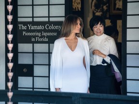 First Lady Melania Trump and Akie Abe, wife of Japanese Prime Minister Shinzo Abe take a tour on Yamato Island at the Morikami Museum and Japanese Gardens in Delray Beach, Fla., on Saturday, Feb. 11, 2017. (Michael Ares/Palm Beach Post via AP)