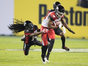 The Hamilton Tiger-Cats signed all-star defensive back Abdul Kanneh (left) away from East Division rival Ottawa Redblacks. (THE CANADIAN PRESS)