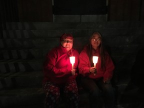 Lyndsay Breadner (left) and Victoria Harrington wait for the 12th annual Memorial March of Edmonton for Missing and Murdered Women to begin on Feb. 14, 2017 at Sacred Heart Church in Edmonton. Michelle LePage / Postmedia