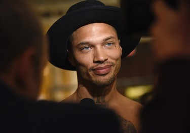 Jeremy Meeks, the model who was referred to as "the hot felon," speaks to media backstage before the Philipp Plein fashion show, Monday, Feb. 13, 2017, in New York. (AP Photo/Diane Bondareff)