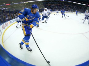 Vladimir Tarasenko of the St. Louis Blues prepares to face two Toronto Maple Leafs players (Getty Images)