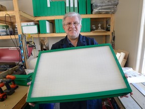 Peter Bruijns, president of Breatheclean Inc., shows a new re-usable furnace filter he has developed in his workshop in Coldstream, Ontario on Monday February 13, 2017 (MORRIS LAMONT, The London Free Press)
