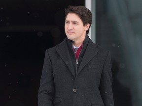 Prime Minister Justin Trudeau boards a government plane bound for Europe in Ottawa on Wednesday, February 15, 2017. (Adrian Wyld/The Canadian Press)