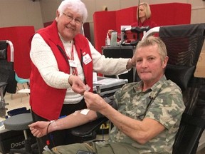 Submitted picture: Canadian Blood Services held a Blood Donors' Clinic on Thursday, Jan. 26 at the UAW Hall. Canadian Blood Services volunteer Elsie Stratton congratulates John Goethals for donating his 100th pint of blood.