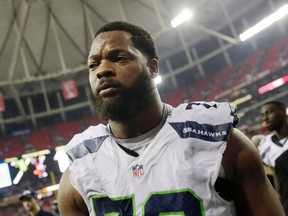 In this Jan. 14, 2017, file photo, Seattle Seahawks defensive end Michael Bennett (72) walks off the field after an NFL football divisional football game against the Atlanta Falcons, in Atlanta. (AP Photo/David Goldman, File)
