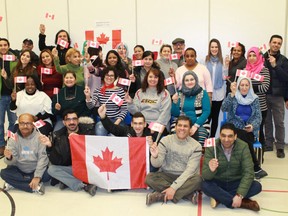 A group of 32 newcomers celebrated the Maple Leaf's 52nd birthday on Feb. 15 – national Flag Day – at Sarnia's YMCA Learning and Career. (Carl Hnatyshyn/Postmedia Network)
