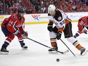 Anaheim Ducks centre Antoine Vermette skates with the puck against Washington Capitals defenceman Brooks Orpik during an NHL game on Feb. 11, 2017. (AP Photo/Nick Wass)