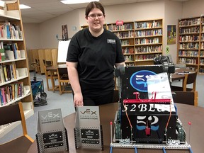 Carlee Rogers, with her robot 52 Blue and some of the awards she has won at robotics championships across Ontario this academic year, at the Bayridge Secondary School library in Kingston. (Mike Norris/The Whig-Standard)