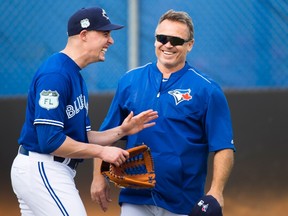 Toronto Blue Jays starting pitcher Aaron Sanchez and manager John Gibbons laugh during spring training in Dunedin, Fla., on Feb. 15, 2017. (THE CANADIAN PRESS/Nathan Denette)