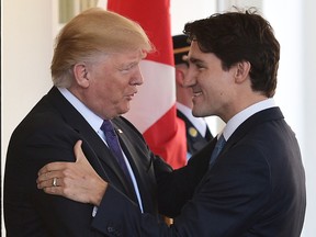 US President Donald Trump(L) greets Canada's Prime Minister Justin Trudeau upon arrival outside of the West Wing of the White House on February 13, 2017 in Washington, DC.  (MANDEL NGAN/AFP/Getty Images)