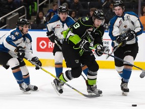 Edmonton Oil Kings forward Nick Bowman (13) battles the Kootenay Ice's Michael King (20), Kaeden Taphorn (26), and Cale Fleury (4) during second period WHL action at Rogers Place on Wednesday Feb. 15, 2017.