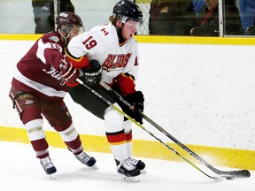 Blenheim Blades' Nick DeLyzer (19) is chased by Dresden Kings' Macks Holmes (16) on Wednesday at Lambton-Kent Memorial Arena. (MARK MALONE/The Daily News)