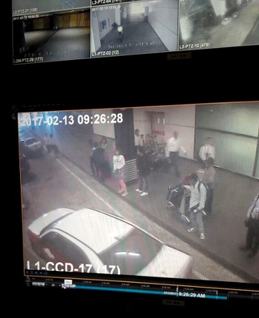This image provided by Star TV on Wednesday, Feb. 15, 2017, of closed circuit television footage from Monday, Feb 13, 2017, shows a woman, center in white, at Kuala Lumpur International Airport in Sepang, Malaysia, who police say was arrested Wednesday in connection with the death of Kim Jong Nam, the half brother of North Korean leader Kim Jong Un. (Star TV via AP) ORG XMIT: TKTT503