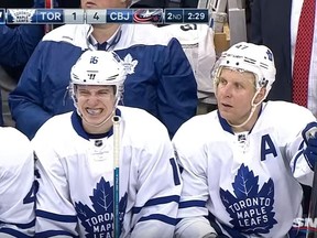 Leafs Mitch Marner, centre, on the bench after crashing into boards in game vs Blue Jackets Wednesday, Feb. 15, 2017. (Sportsnet screengrab)