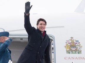 Prime Minister Justin Trudeau boards a government plane in Ottawa, Wednesday, February 15, 2017.  THE CANADIAN PRESS/Adrian Wyld
