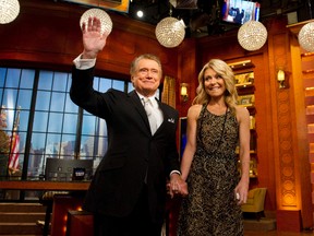 In this Friday, Nov. 18, 2011, file photo, Regis Philbin and Kelly Ripa appear on Regis' farewell episode of "Live! with Regis and Kelly", in New York. Philbin said he hasn't kept in touch with Ripa, his former co-host, since he decided to leave the show they headlined together. (AP Photo/Charles Sykes, File)