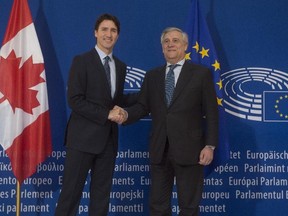 Prime Minister Justin Trudeau (left) is greeted by the President of the European Parliament, Antonio Tajani, as he arrives at the European Parliament in Strasbourg, France, on Thursday, Feb. 16, 2017. (Adrian Wyld/The Canadian Press)