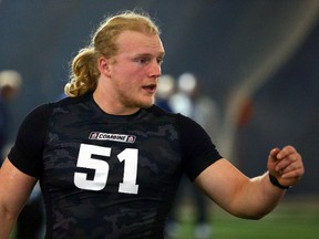 James Tuck gets direction during CFL regional combine testing at Varsity Stadium in Toronto on March 20, 2014. (Dave Abel/Toronto Sun)