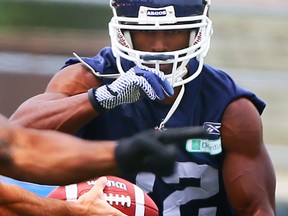 Andre Durie gets the ball during Argos practice at York University in Toronto on  June 23, 2014. (Dave Abel/Toronto Sun)