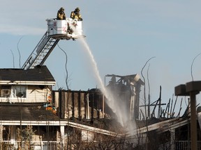 Edmonton Fire Rescue Services firefighters battle a blaze at Westridge Estates in Edmonton on Thursday, February 16, 2017. Ian Kucerak / Postmedia