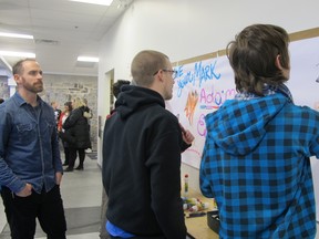 Kaboom! Arts After School Program kicked off on Wednesday, at which teens attend workshops with local artists every week until December. The program's artistic director Mat Poirier, left to right, is pictured with Boys and Girls supervising staff Cody Boyington and Nathan Moore, who is one of the teens in the program. (Rachel Levy-McLaughlin/For The Whig-Standard)