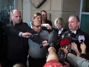 Crown Prosecuters Shane Parker and Vicki Faulkner speak to members of the media at Calgary Courts in Calgary, Alta., on Thursday February 16, 2017, after Douglas garland is charged with first-degree murder. Leah Hennel/Postmedia