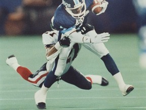 Toronto Argonauts' Darrell Smith runs up field for extra yardage during a CFL game in 1990. (THE CANADIAN PRESS/Hans Deryk)
