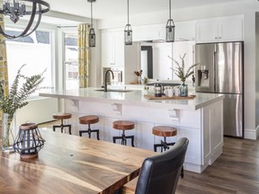 A one-time traditional house in the east end of Toronto is given a modern, open concept kitchen that serves as the hub of the family home.