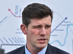 Mayor Don Iveson, with a map of future and current LRT routes in back, pushes for some provincial budget money for LRT buildout funding to the west end, speaking here at the Lewis Farms Estates bus station in Edmonton, Thursday, February 16, 2017.  Ed Kaiser/Postmedia