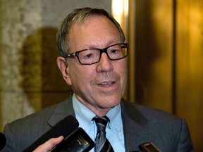 Liberal MP Irwin Cotler speaks with the media following Liberal party caucus Wednesday October 8, 2014 in Ottawa. Former justice minister Cotler says a Liberal-backed motion aimed at combating racism would have broader support if it didn't contain the word "Islamophobia." (THE CANADIAN PRESS/Adrian Wyld)