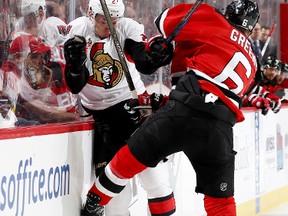 Curtis Lazar of the Ottawa Senators and Andy Greene of the New Jersey Devils collide during an NHL game on Feb. 16, 2017 at Prudential Center. (Elsa/Getty Images)