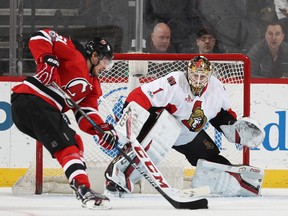 Mike Condon of the Ottawa Senators stops a shot by Sergey Kalinin of the New Jersey Devils during an NHL game on Feb. 16, 2017 at Prudential Center. (Elsa/Getty Images)