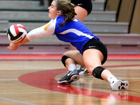 Corina Simpson of the Oaks lunges to pick up a spike during their TVRA AAA senior girls volleyball final at Fanshawe College in London, Ont. on Thursday February 16, 2017.  The Oaks won 3-1 but since both get through to WOSSAA next week, there's a good chance the two powerhouses will meet again. (MIKE HENSEN, The London Free Press)