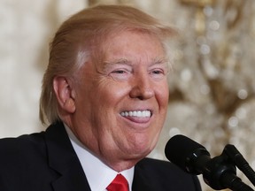 U.S. President Donald Trump smiles during a news conference announcing Alexander Acosta as the new Labor Secretary nominee in the East Room at the White House on February 16, 2017 in Washington, DC. (Getty)