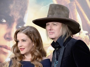 Singer Lisa Marie Presley (L) and musician Michael Lockwood attend the premiere of Warner Bros. Pictures' 'Mad Max: Fury Road' at TCL Chinese Theatre on May 7, 2015 in Hollywood, California. (Photo by Frazer Harrison/Getty Images)