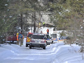 Provincial police investigate after a snowmobile collided with a train near Midhurst, north of Barrie. A man later died in hospital. MARK WANZEL/PHOTO