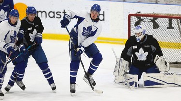 Toronto Maple Leafs Auston Matthews prepares to set a screen in front of goalie Curtis McElhinney at practice in preparation for another Battle of Ontario at the ACC Saturday night in Toronto on Friday February 17, 2017. Jack Boland/Toronto Sun/Postmedia Network