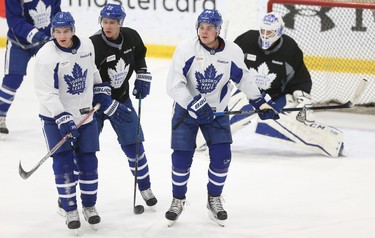 Toronto Maple Leafs Zach Hyman (11), Nikita Zaitsev (22) and Auston Matthews cause traffic in front of the net at practice in preparation for another Battle of Ontario at the ACC Saturday night in Toronto on Friday February 17, 2017. Jack Boland/Toronto Sun/Postmedia Network