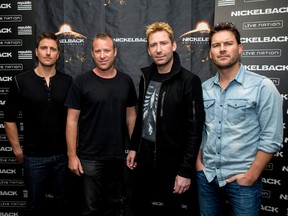 Daniel Adair, Chad Kroeger, Mike Kroeger and Ryan Peake of Nickelback pose at the special announcement and live performance at the House of Blues on the Sunset Strip November 5, 2014 in West Hollywood, California. (Photo by Mark Davis/Getty Images)