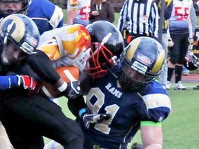 Jason South, right, helps make a tackle while playing for the Gmundner Rams of the Austrian football league's third division in 2015. The 26-year-old Petrolia native has signed with the Leipzig Lions and will be joining the German football league third-division team in two weeks. (Handout)