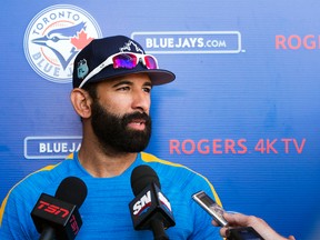 Toronto Blue Jays right fielder Jose Bautista speaks with reporters during baseball spring training in Dunedin, Fla., on Friday, February 17, 2017. (THE CANADIAN PRESS/Nathan Denette)