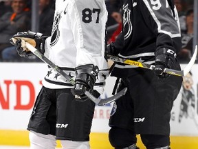 Sidney Crosby #87 of the Pittsburgh Penguins and Connor McDavid #97 of the Edmonton Oilers react during the 2017 Honda NHL All-Star Tournament Final between the Pacific Division All-Stars and the Metropolitan Division All-Stars at Staples Center on January 29, 2017 in Los Angeles, California.