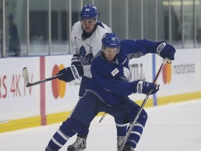 Maple Leafs rookies Auston Matthews (left) and Connor Brown wheel around at practice in preparation for another Battle of Ontario at the Air Canada Centre tonight. (Jack Boland/Toronto Sun)