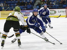 Ryan Valentini, right, of the Sudbury Wolves, attempts to get around Adam Thilander, of the North Bay Battalion, during OHL action at the Sudbury Community Arena in Sudbury, Ont. on Friday February 17, 2017. John Lappa/Sudbury Star/Postmedia Network