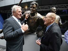 Darryl Sittler and Johnny Bower in front of Sittlers bronzed statue. (Craig Robertson/Toronto Sun)