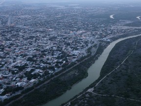 The Rio Grande stretches westward, forming the border between Reynosa, Mexico, and the United States. (John Moore/Getty Images)